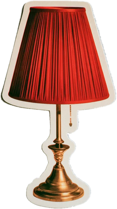 A bedside lamp with a red pleated shade